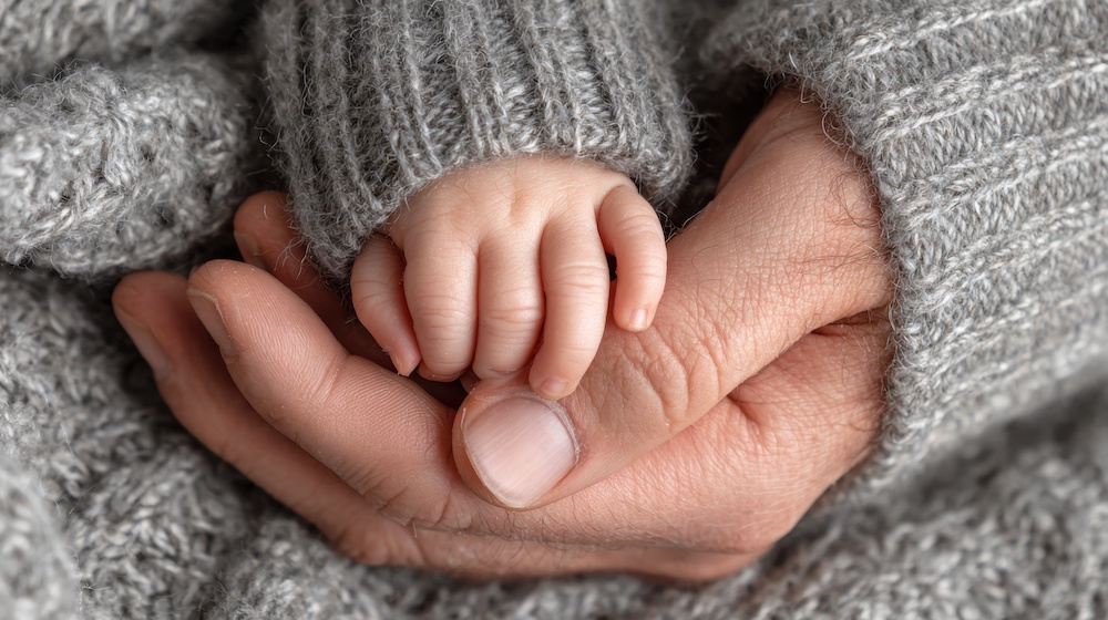 Doctor speaking with parents about baby care
