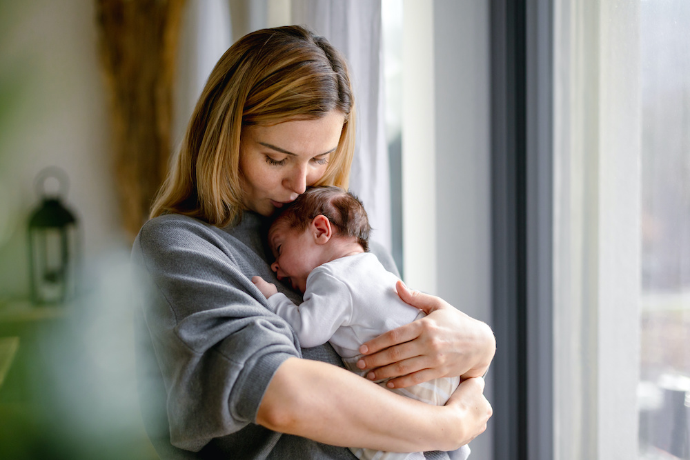 Mother comforting newborn after circumcision at Precision Circumcision Clinic in Bankstown